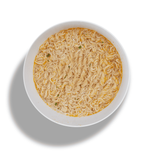 Vifon Kurczak Łagodny – yellow packaging of mild chicken instant noodle soup with garlic, lime, and herbs shown next to a bowl of noodles.