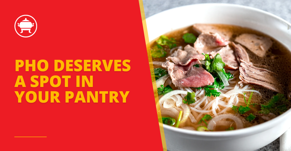 Bowl of Vietnamese pho with thin rice noodles, sliced rare beef, brisket, fresh herbs, and clear broth, served in a white bowl.