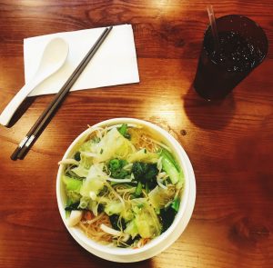 Best Vietnamese Food in London: Where Tradition Meets Modern Taste Vietnamese noodles served with fresh lettuce on a wooden table.