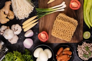 Gluten-Free Instant Ramen Noodles: Enjoy Comfort Without Compromise Noodles arranged with fresh ingredients around them, highlighting key components.