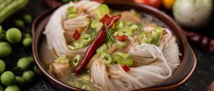 Vietnamese Chicken Dishes: Authentic Flavour Made Easy at Home Spicy noodle soup with green onions and chili, highlighting bold flavours.